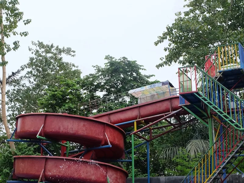 a water park with a water slide and a pool